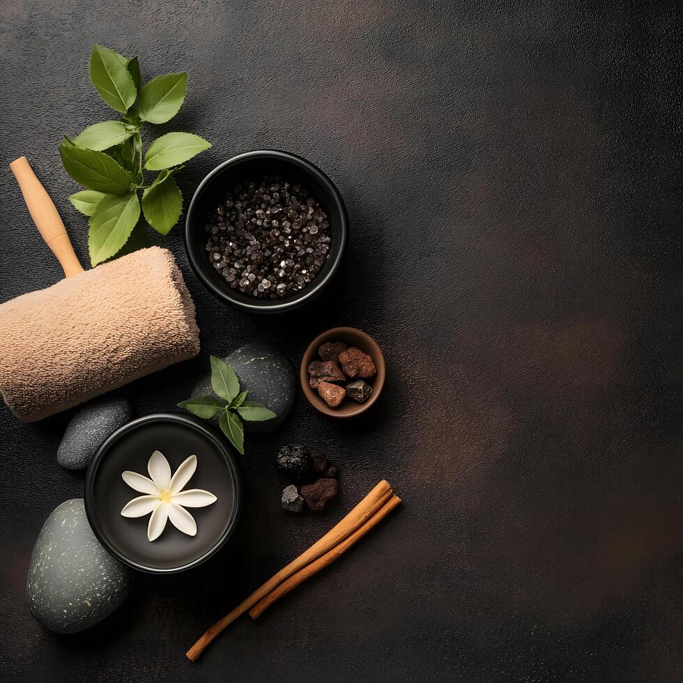 Spa still life features stones, flower, sea salt, towel, and cinnamon sticks arrangement photo