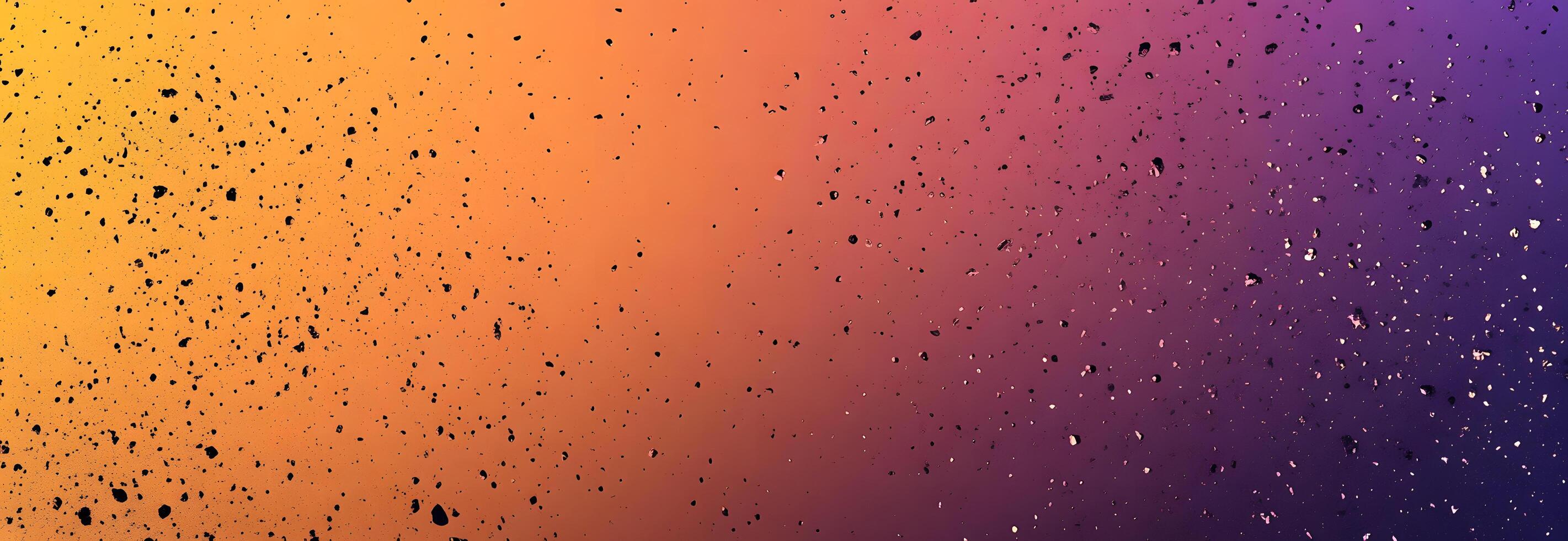 Splattered droplets create an abstract pattern transitioning between warm orange hues and cool purple tones effectively photo