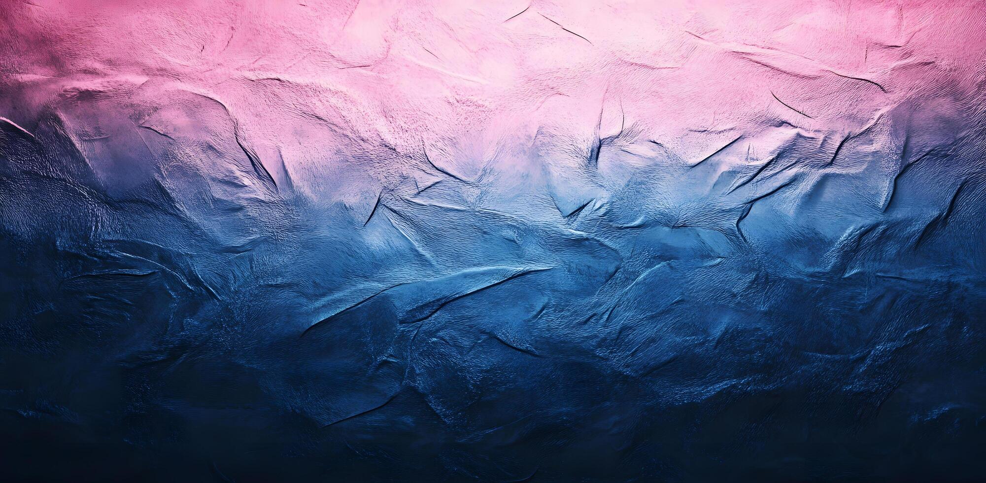 Textured background displays a vibrant gradient from pink to deep blue across an uneven surface photo