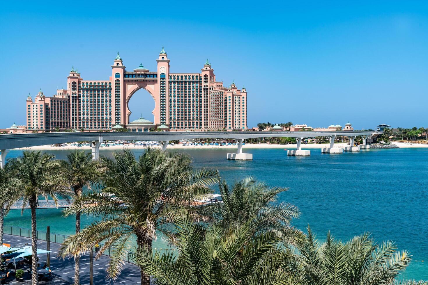 Dubai, United Arab Emirates - March 17, 2023-view of the famous Atlantis Hotel and palm tree during a sunny day photo