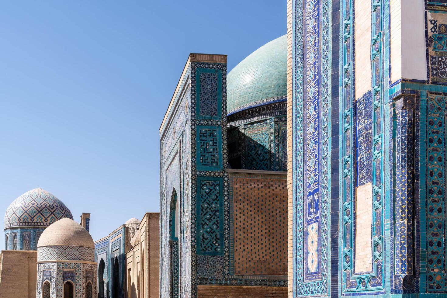 Samarkand,Uzbekistan-august 13, 2023-Particular of Shakhi Zinda necropolis, a famous mausoleum complex in Samarkand during a sunny day photo