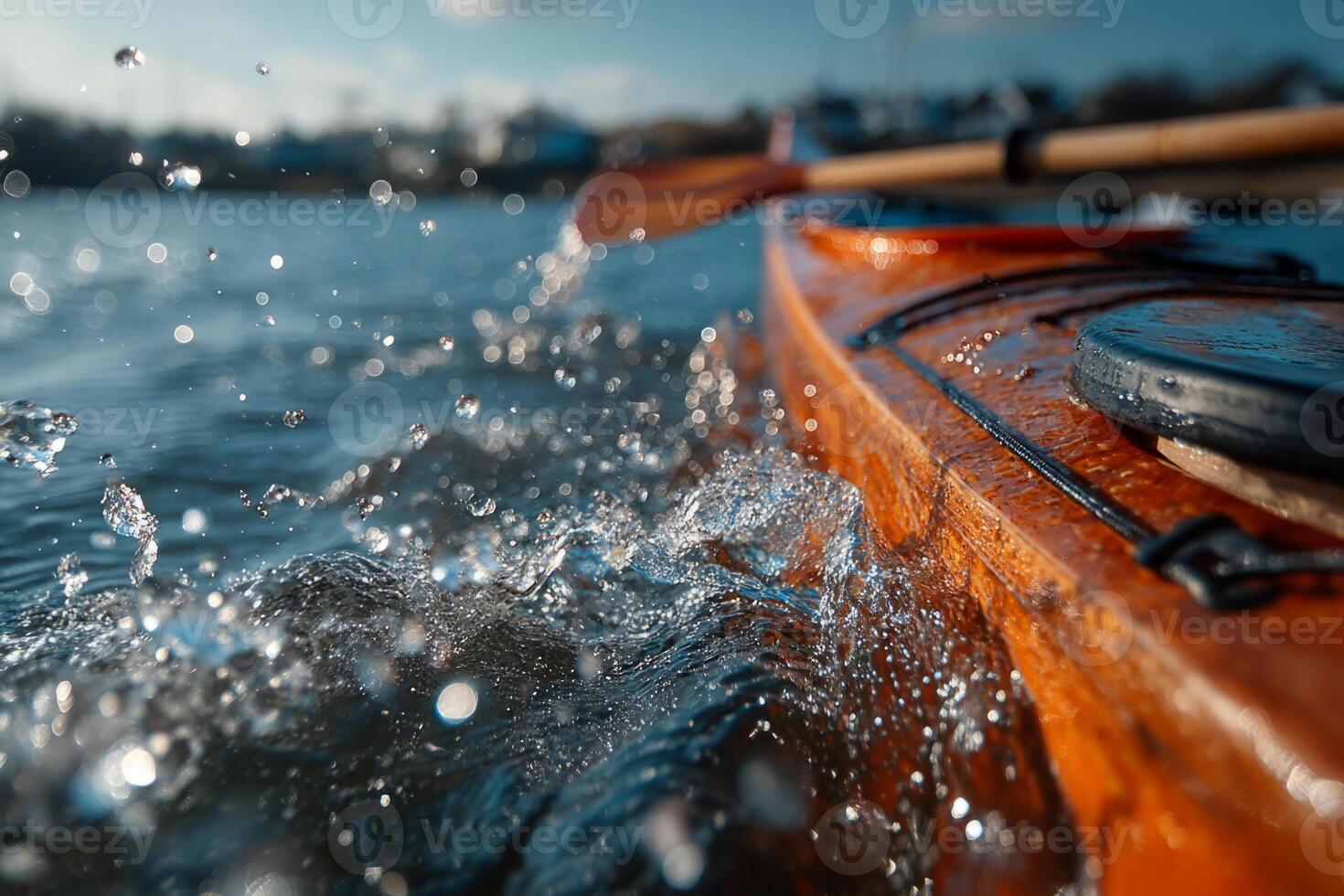 Paddle splashing water during kayaking photo