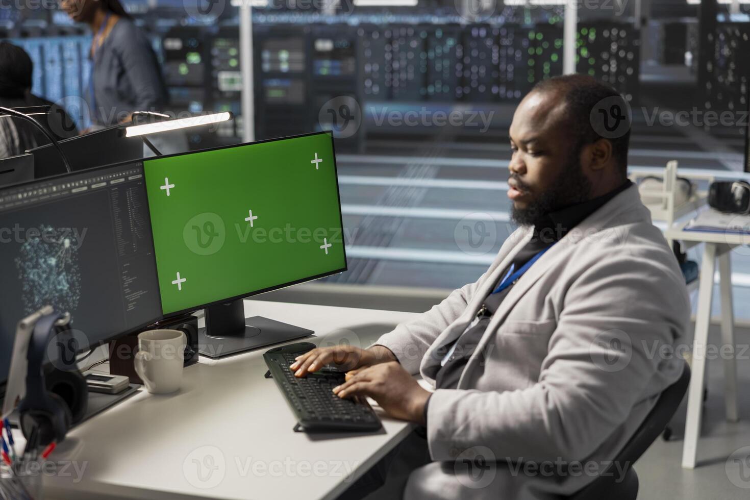 Data center engineer analyzing software logs metrics on green screen mockup PC, optimizing storage systems. Server farm IT expert inspecting resource utilization on chroma key isolated screen computer photo