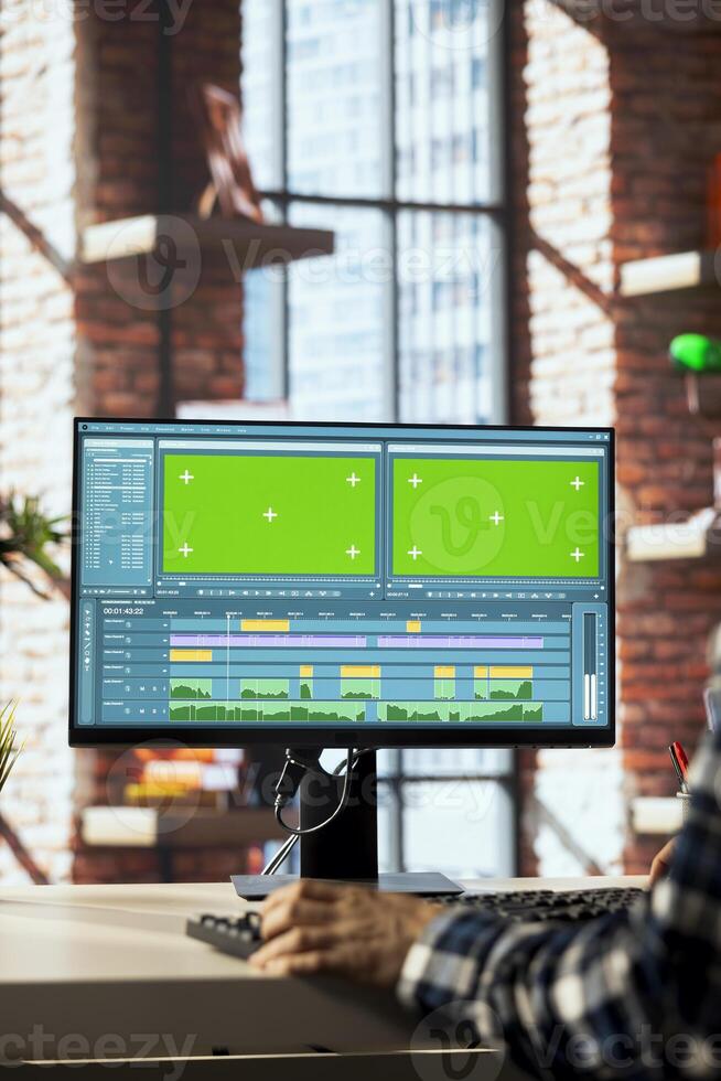editor polishes raw footage on chroma key PC and improving audio quality. Videographer professionally adjusting clips on isolated screen computer monitor, applying sound effects to film, closeup photo