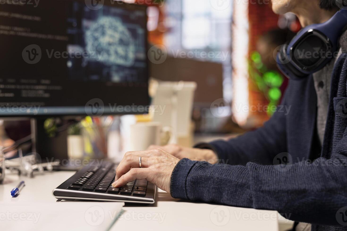 Engineer typing on computer keyboard in startup office designing, coding and debugging applications in different software languages. Close up of IT employee doing code testing and quality assurance photo