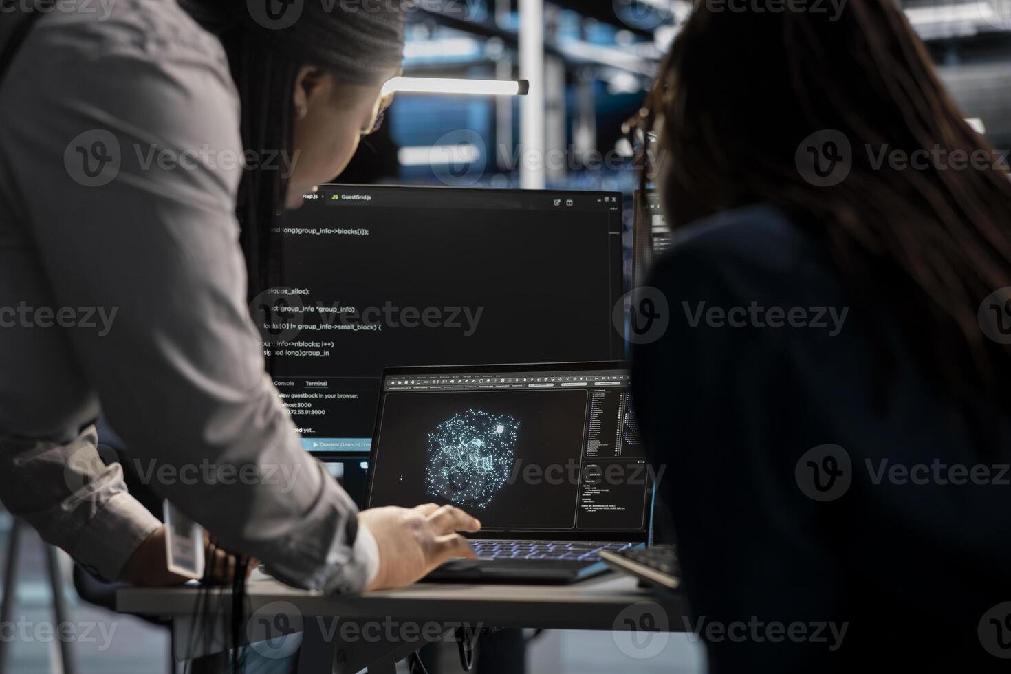 Data center engineering team using AI visualization tool to optimize resource allocation. Server farm teamworking colleagues use artificial intelligence analysis software to do maintenance photo