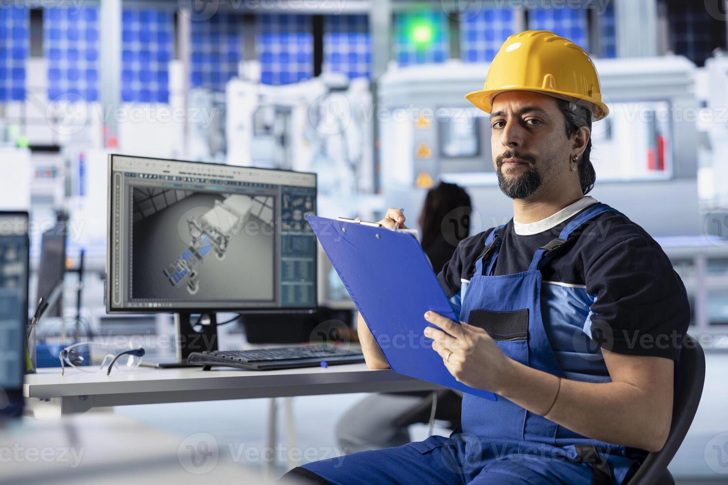 Portrait of photovoltaics factory engineer looking over paperwork documents, analyzing data. Solar panels manufacturing plant employee reading documentation files to learn how to troubleshoot errors photo