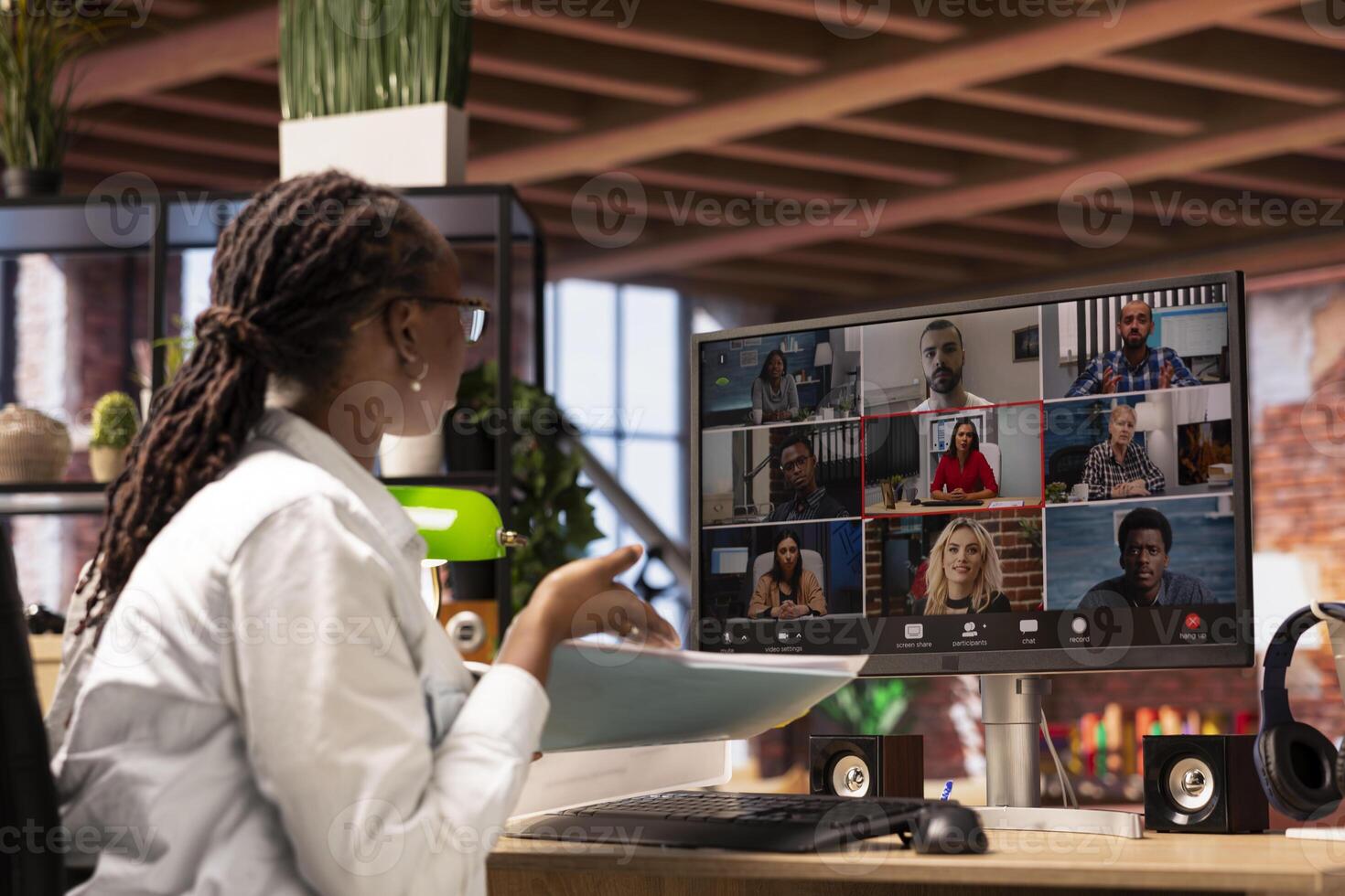 Woman at home answering videocall from board of directors checking tasks progress, showing documents. Teleworker in videoconference with management executives, presenting progress done photo