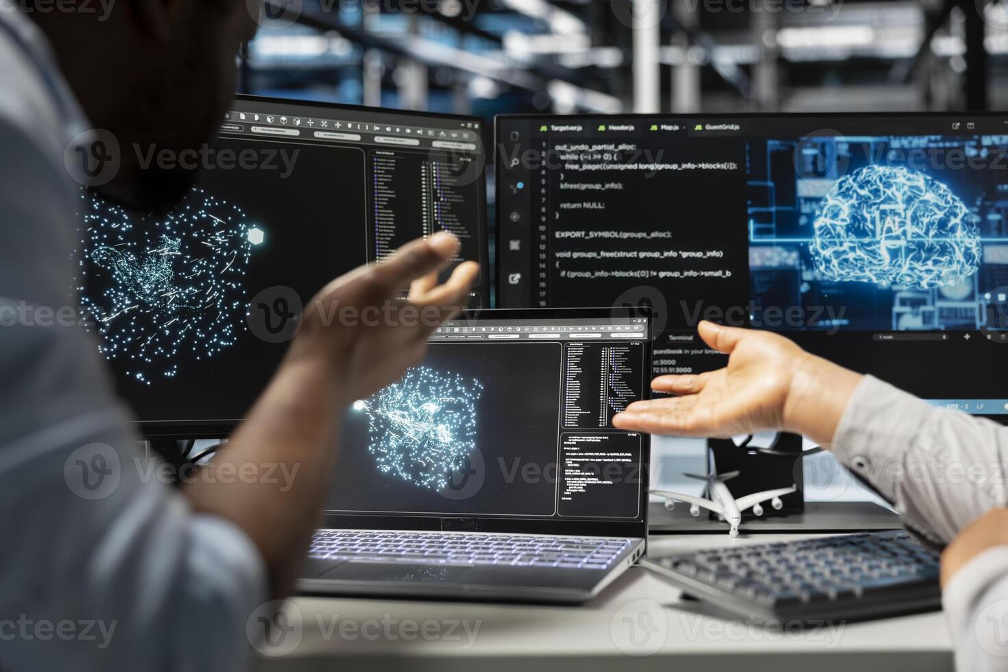 Server farm engineering team looks at data analysis graph to reduce supercomputers failure. Data center coworkers look at AI visualization dashboard to pinpoint gear performance glitches photo