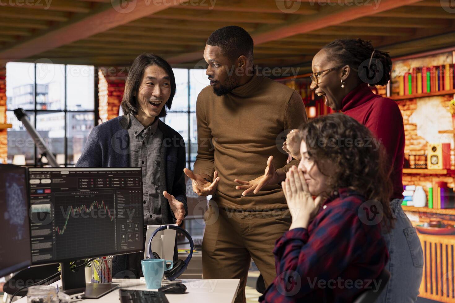 Happy startup team celebrating milestone after company goes public through IPO, obtaining capital. Tech business securing angel investments after proving rapid technological advancement photo