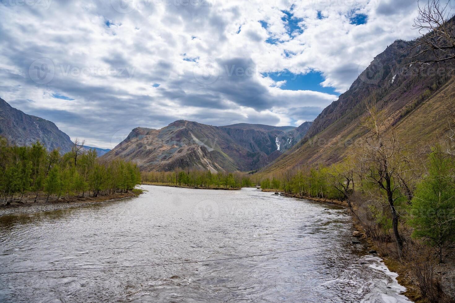 Wide Chulyshman riverbed near Katu Yaryk pass in Altai mountains Russia Powerful mountain waterway flowing through open valley. High quality photo