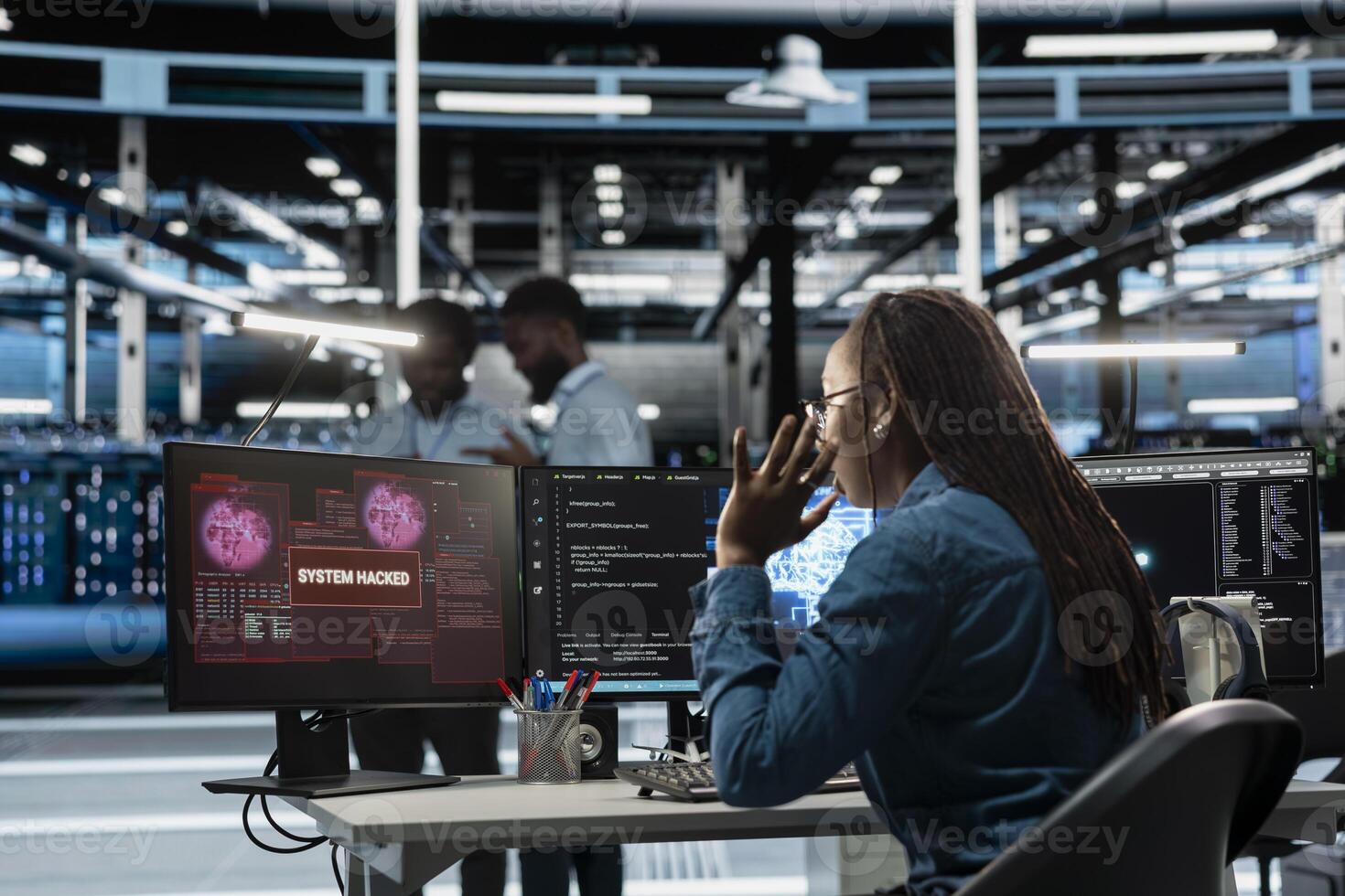 Engineer in AI server hub panicked by hacker attack stealing sensitive information, trying to protect hardware. Artificial intelligence data center worker scared by virus during security breach photo