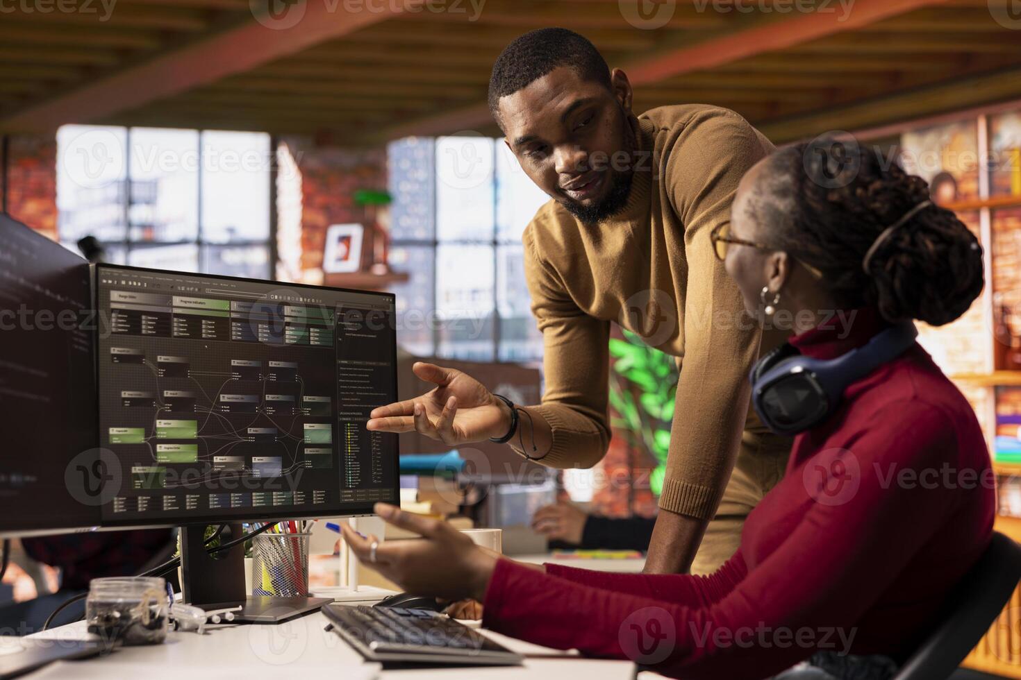IT startup office coworkers doing brainstorming, designing and implementing algorithms enabling machine learning. Team of tech venture employees collaborating to review code and fix bugs photo