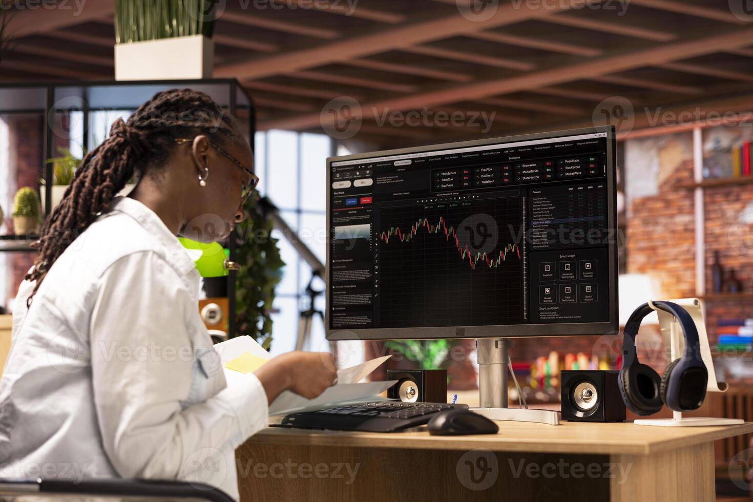 Woman using PC to purchase and sell stocks, reading files, aiming to capitalize on market trends and fluctuations. Investor tracking stock forex trends on computer monitor, looking at documents photo