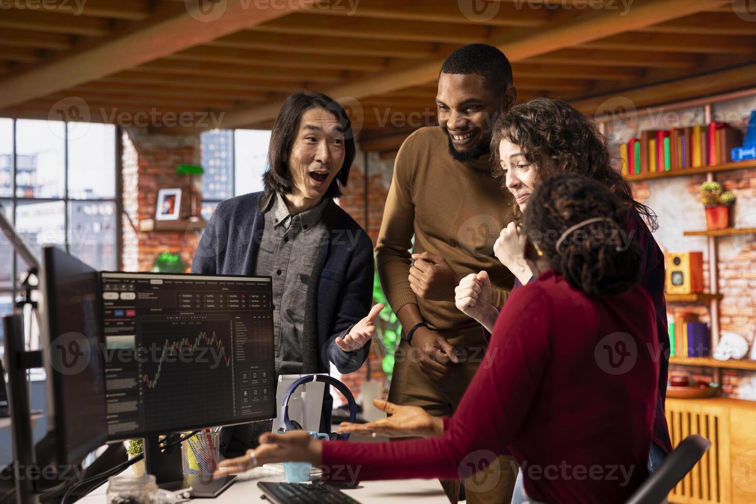 Diverse startup team congratulate each other after successfully launching on stock market, generating high investment returns. Multiethnic tech venture company securing funding for pioneering software photo