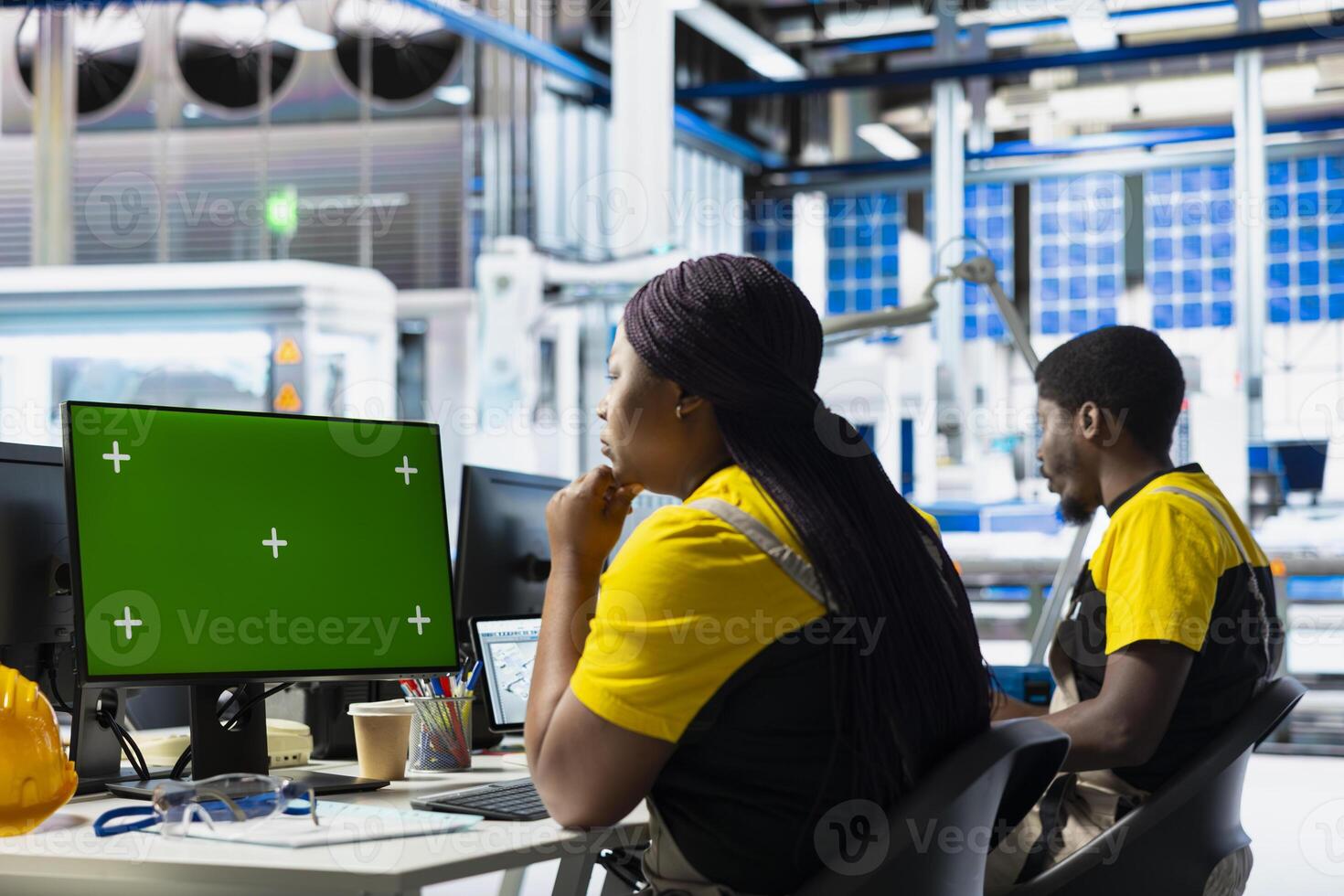 Manufacturing plant employee reviews data on green screen pc to improve the production line, eco friendly solar power. Solar panels female engineer identifying system errors using mockup. photo