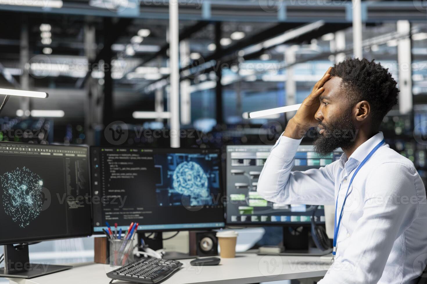 Data center admin troubled by errors while using machine learning algorithms to analyze datasets. Server farm worker doing face palm after glitch found while using AI to recognize data patterns photo