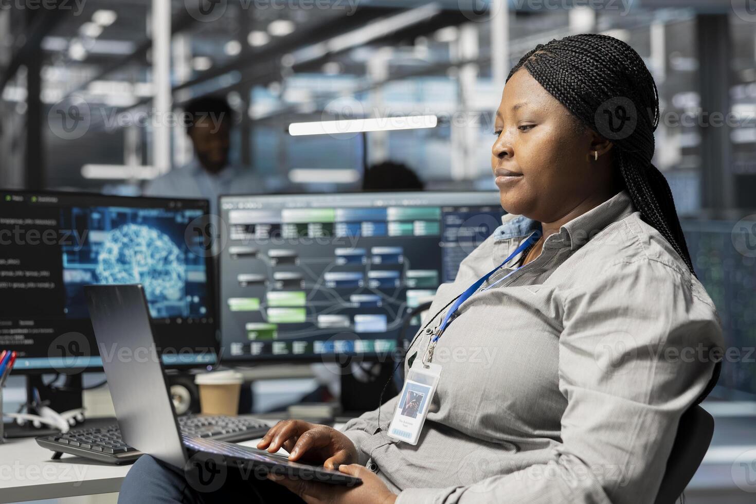 Data center admin using artificial intelligence neural networks node trees on laptop. Server room specialist using using AI programming language on notebook, configuring specialized hardware photo