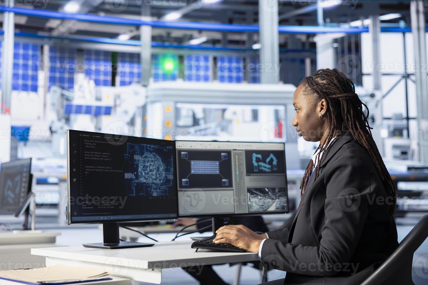 Engineer coding in solar panel plant, using artificial intelligence to automate equipment processes. Photovoltaics factory programmer writing scripts to optimize robotic operations using AI tech photo