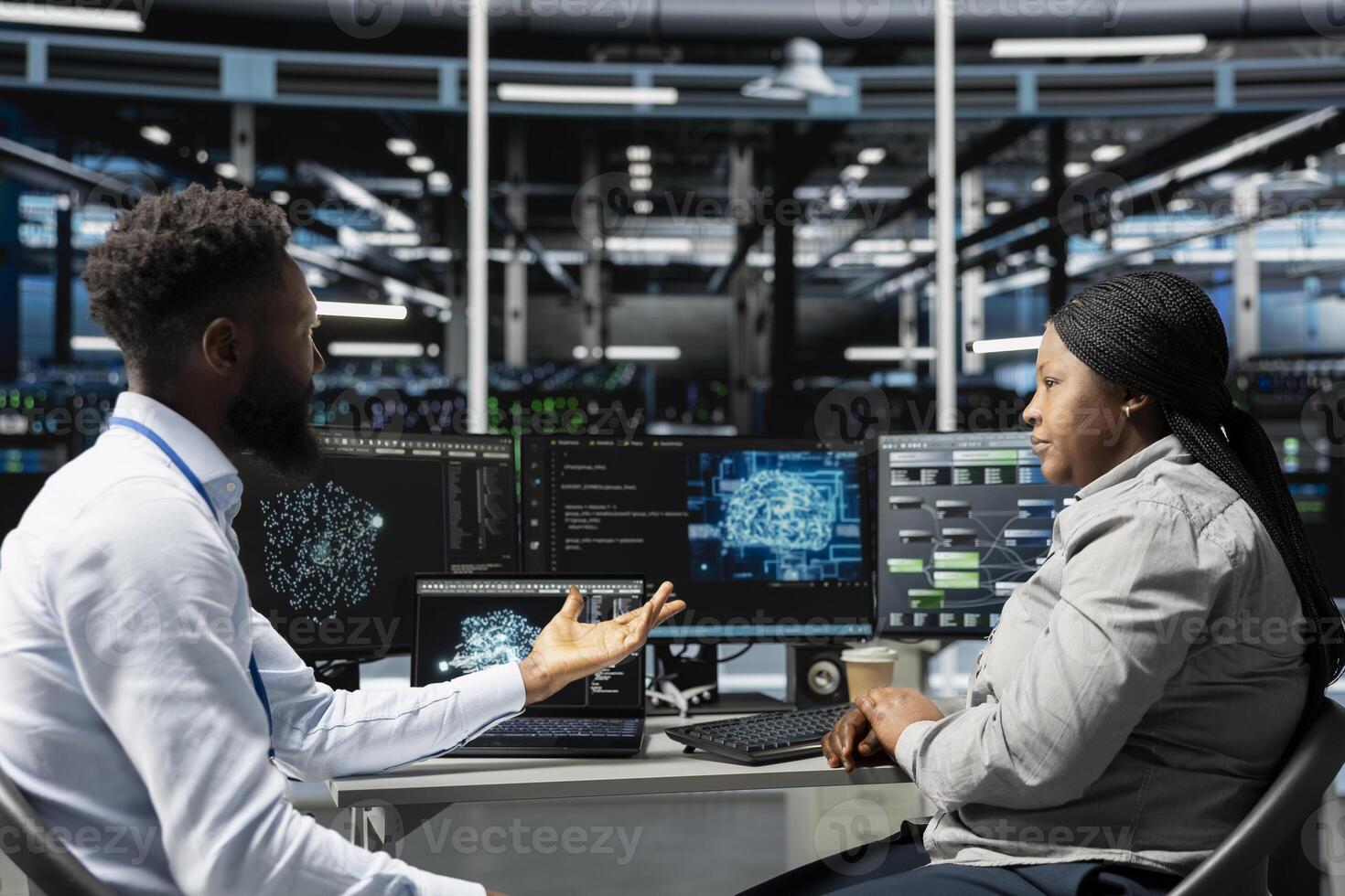 Server farm teamworking colleagues using AI algorithms categorizing and clustering unstructured data. Data center engineering team using Natural Language Processing tech to analyze information photo