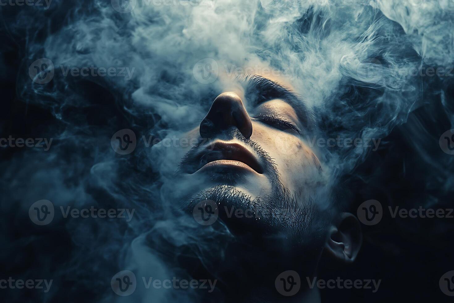 A man is smoking in front photo