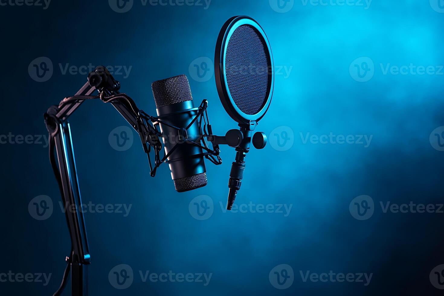 A microphone and a microphone stand on a blue background photo