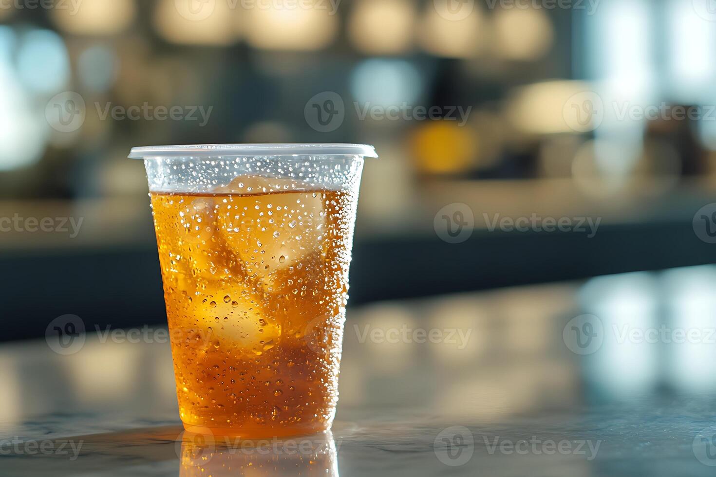 A cup of iced tea sitting on a table photo