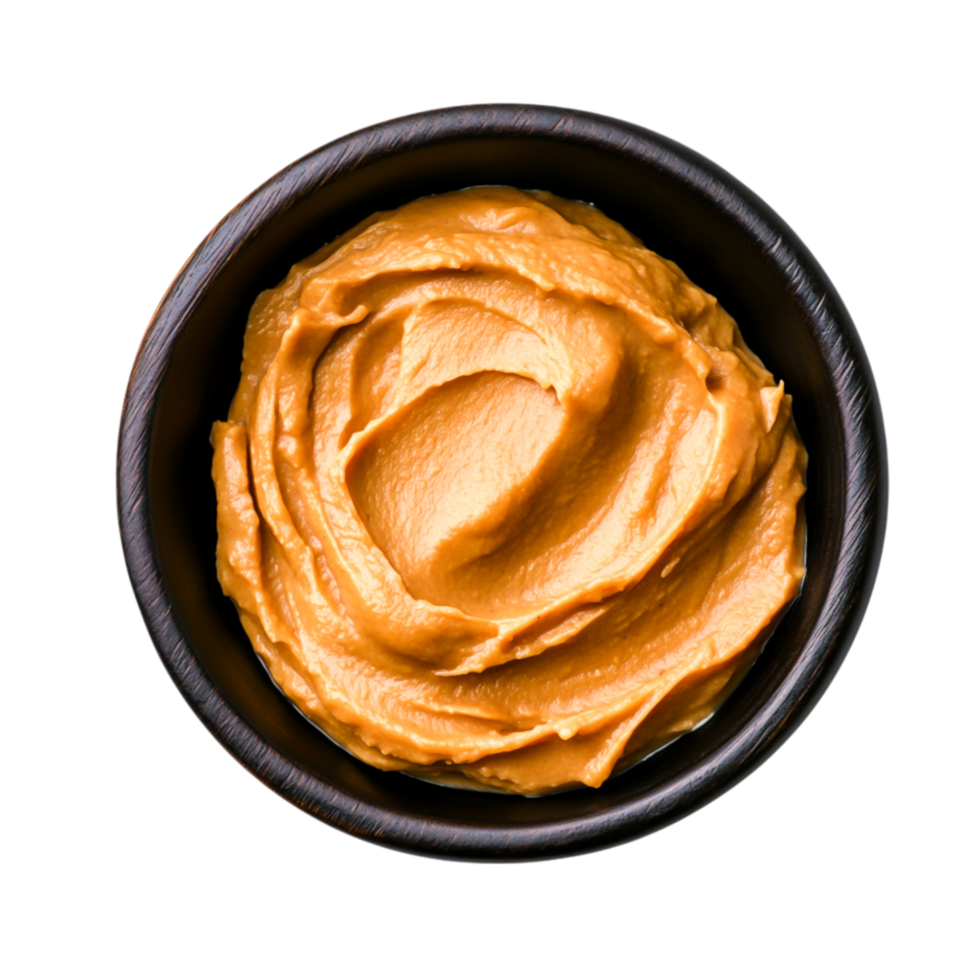 Smooth and Creamy Peanut Butter in Wooden Bowl Ready for Spreading and Cooking png