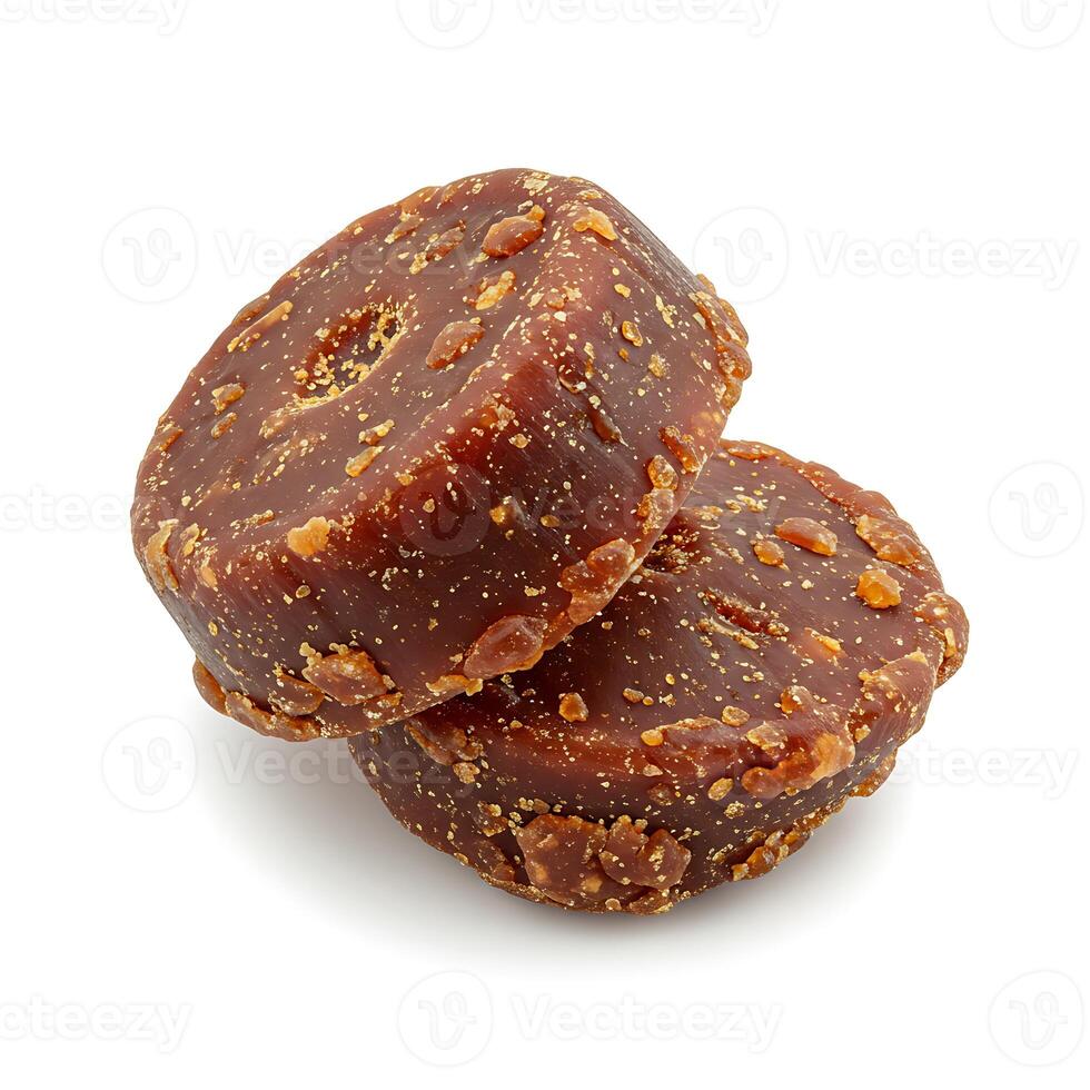two round pieces of brown sugar isolated on a white background photo