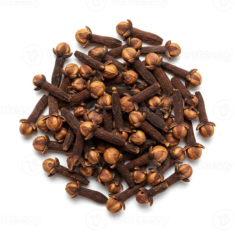cloves are scattered on a white background photo