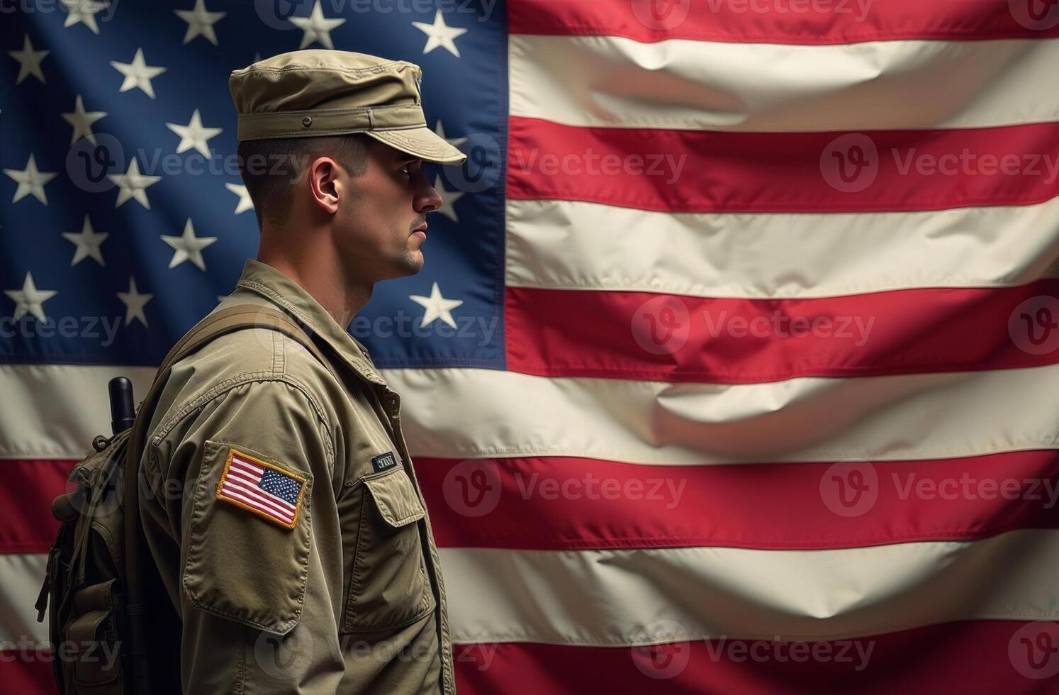 Soldier standing proudly with an American flag in the background during a military ceremony in the United States photo