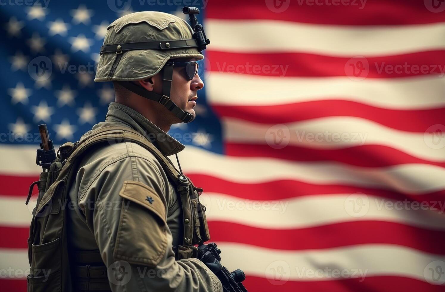 Soldier in tactical gear stands solemnly in front of a waving American flag during a commemorative event in the early morning light photo