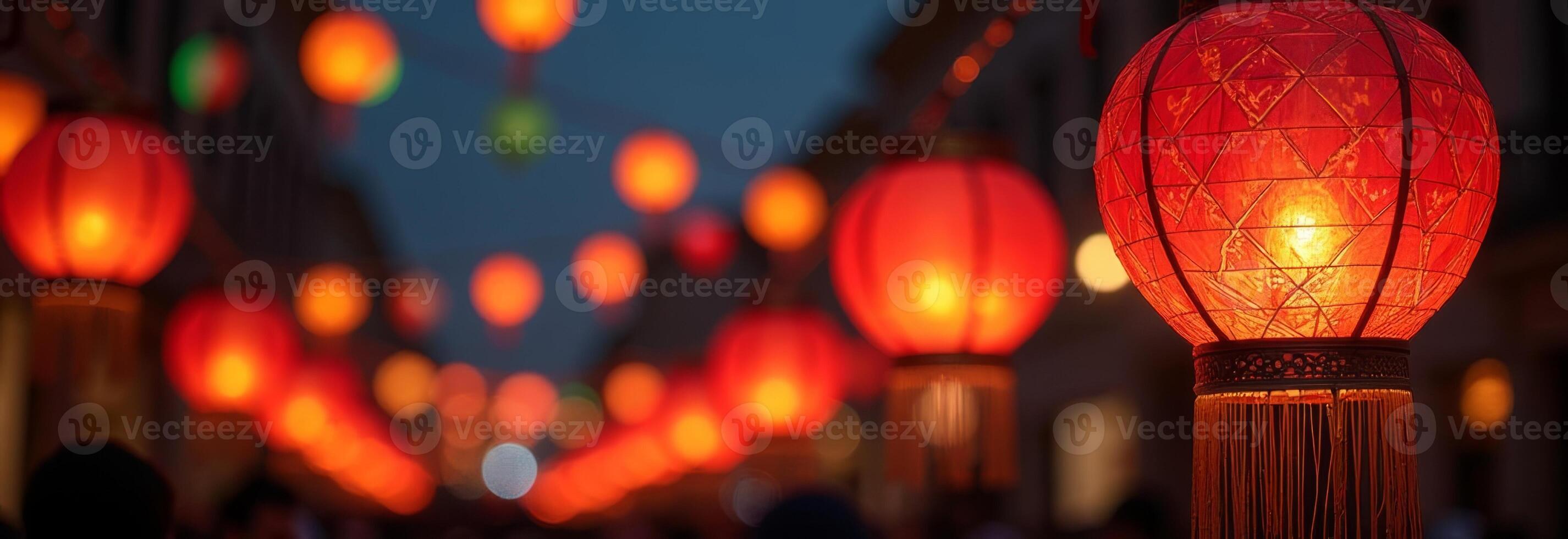 Decorative red lanterns illuminate a festive street during an evening celebration, creating a vibrant atmosphere photo