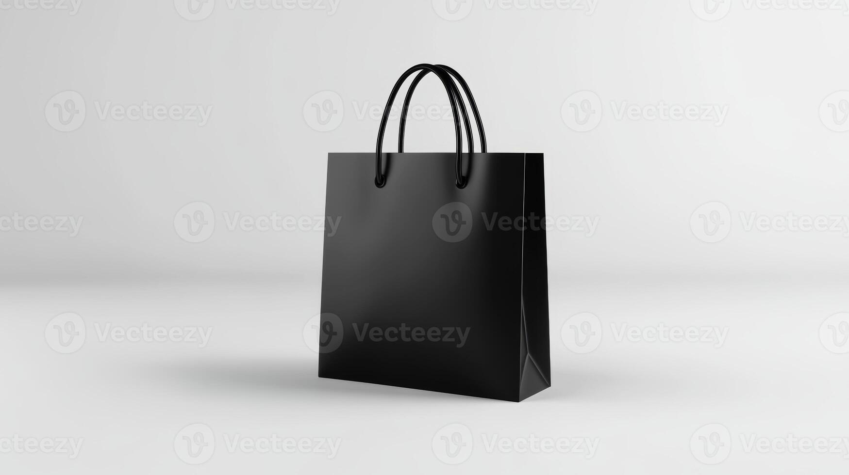Simple black paper shopping bag displayed on a light background during indoor setting suitable for various retail environments photo