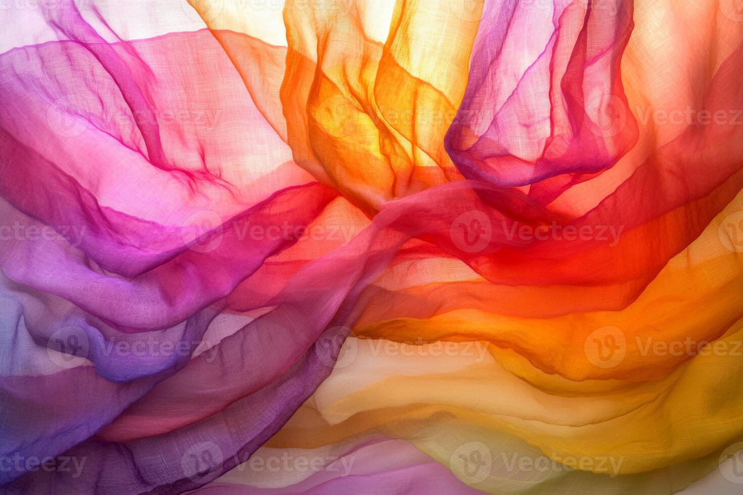 Colorful flowing fabric creates a vibrant abstract pattern in soft light during a warm afternoon photo