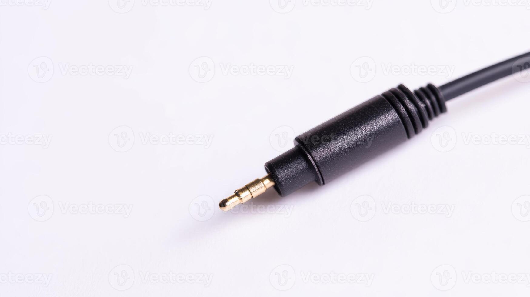 Detailed view of a black audio jack connector on a white surface for electronics enthusiasts photo
