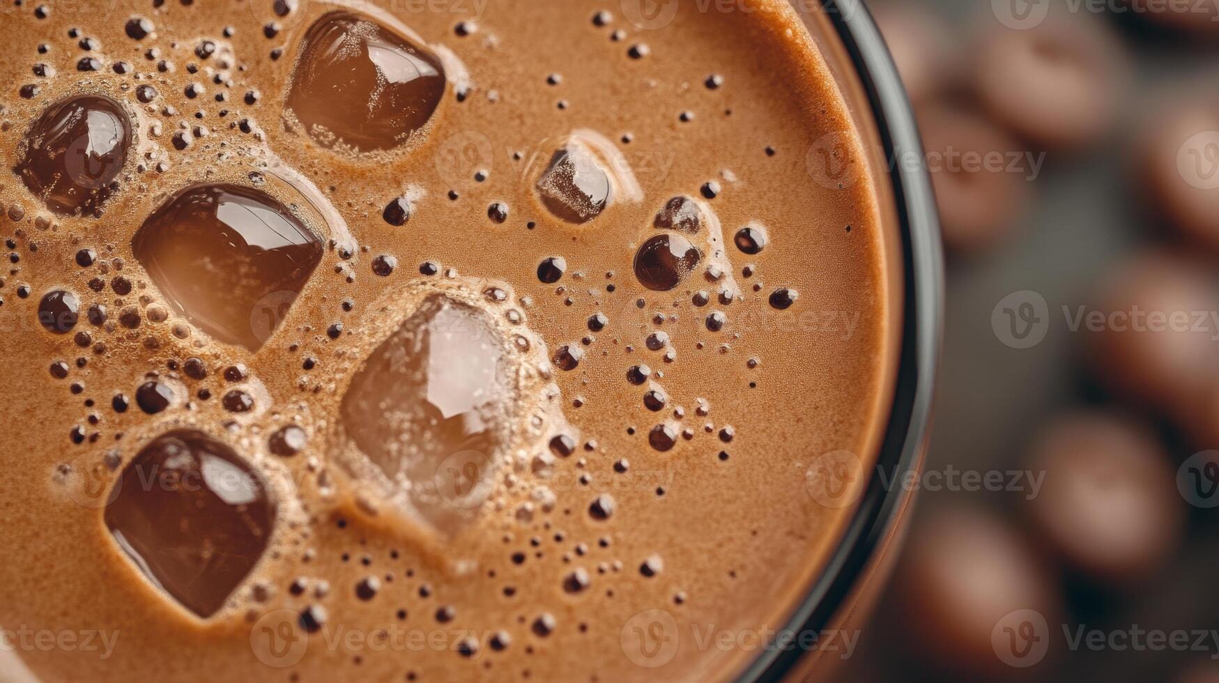 Rich chocolate beverage with ice cubes and frothy texture, perfect for warm days, indulgent treat for chocolate lovers, refreshing drink concept photo