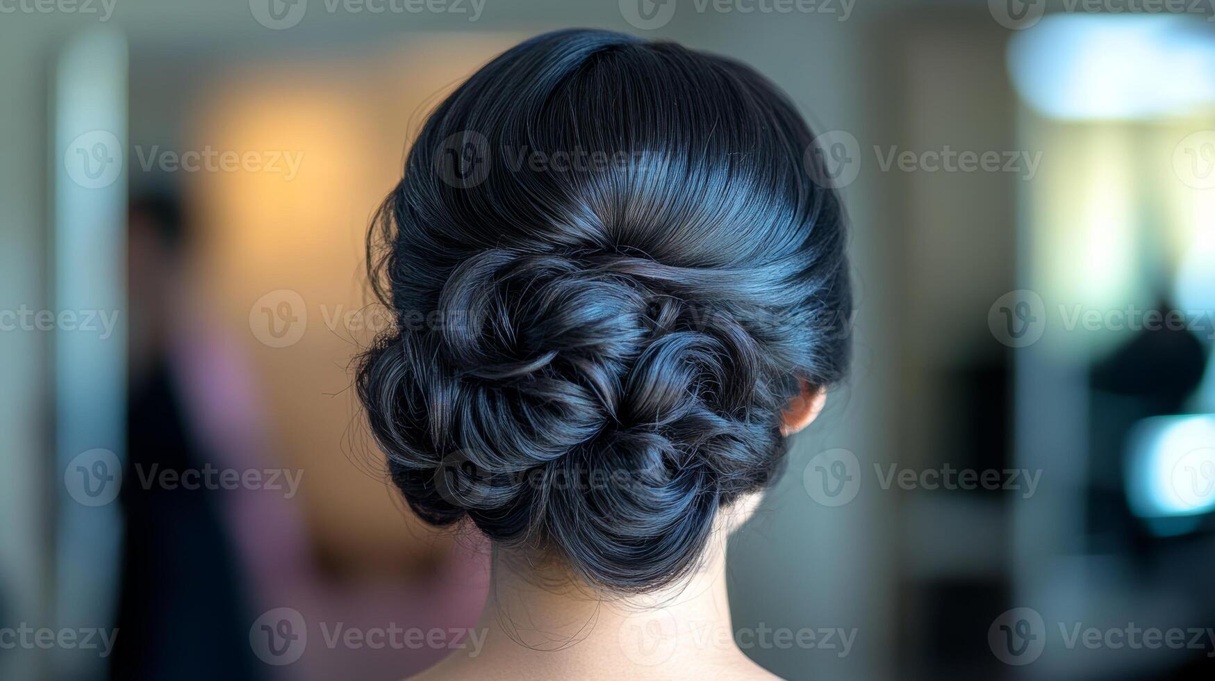 Elegant updo showcasing intricate details for an evening soiree in a beautifully lit setting photo