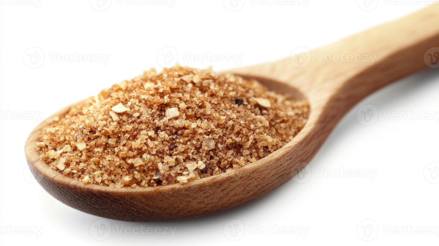 Brown sugar on a wooden spoon showing its rich texture and color for culinary use in desserts and baking photo