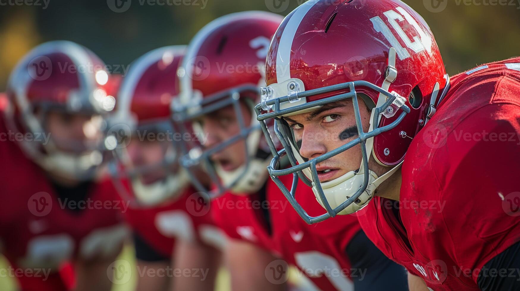 Intense football practice on a sunny afternoon with players focused on the game photo
