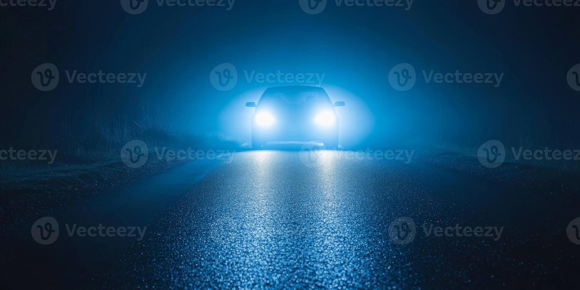 Bright lights illuminate a dark road on a misty night, creating an atmosphere of mystery and intrigue photo