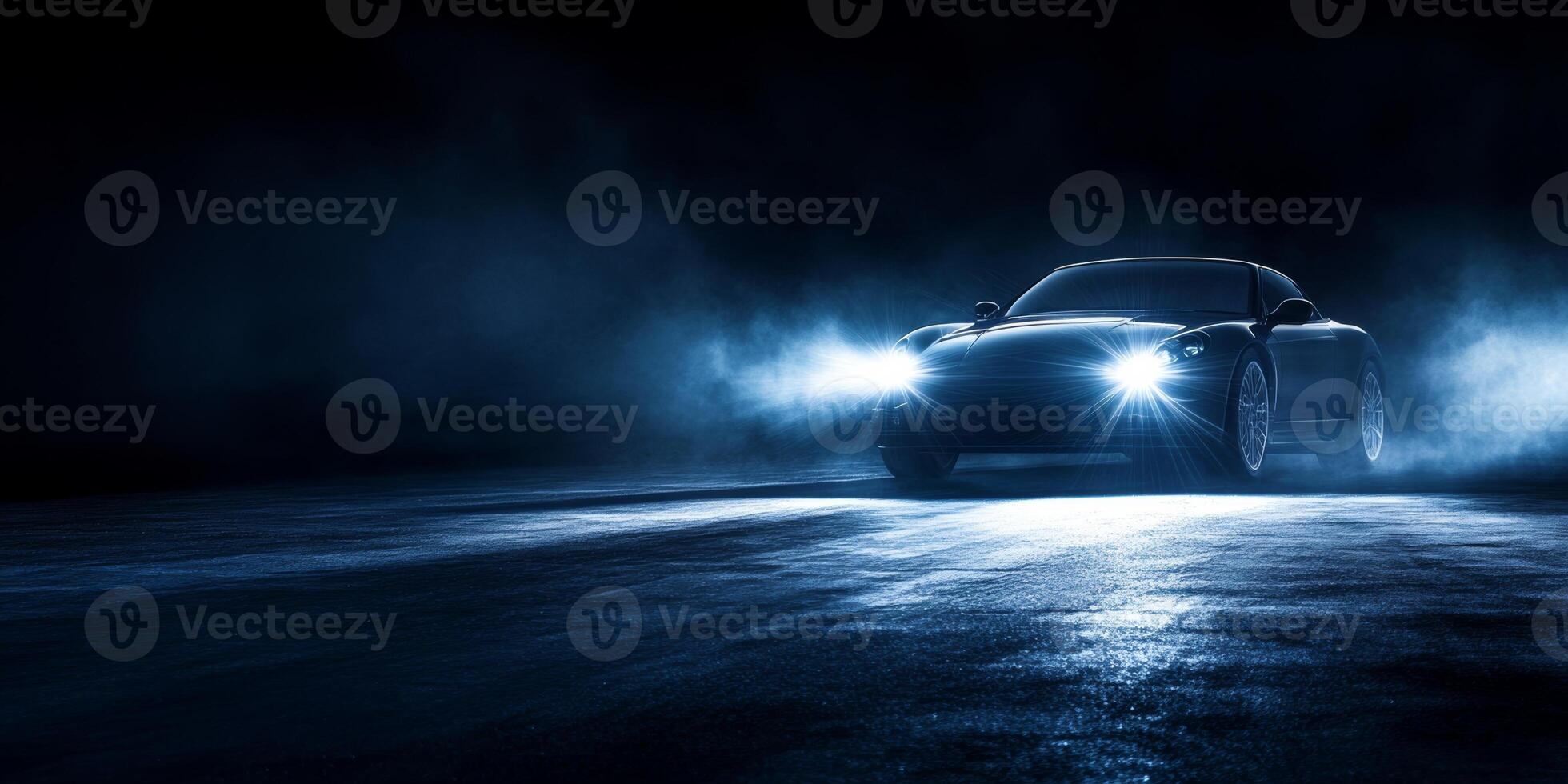 Sleek black sports car illuminated by headlights in a moody atmosphere at night photo