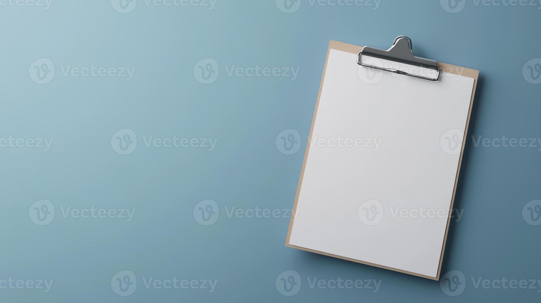 Blank clipboard ready for notes in a modern workspace setting on a calm blue backdrop photo