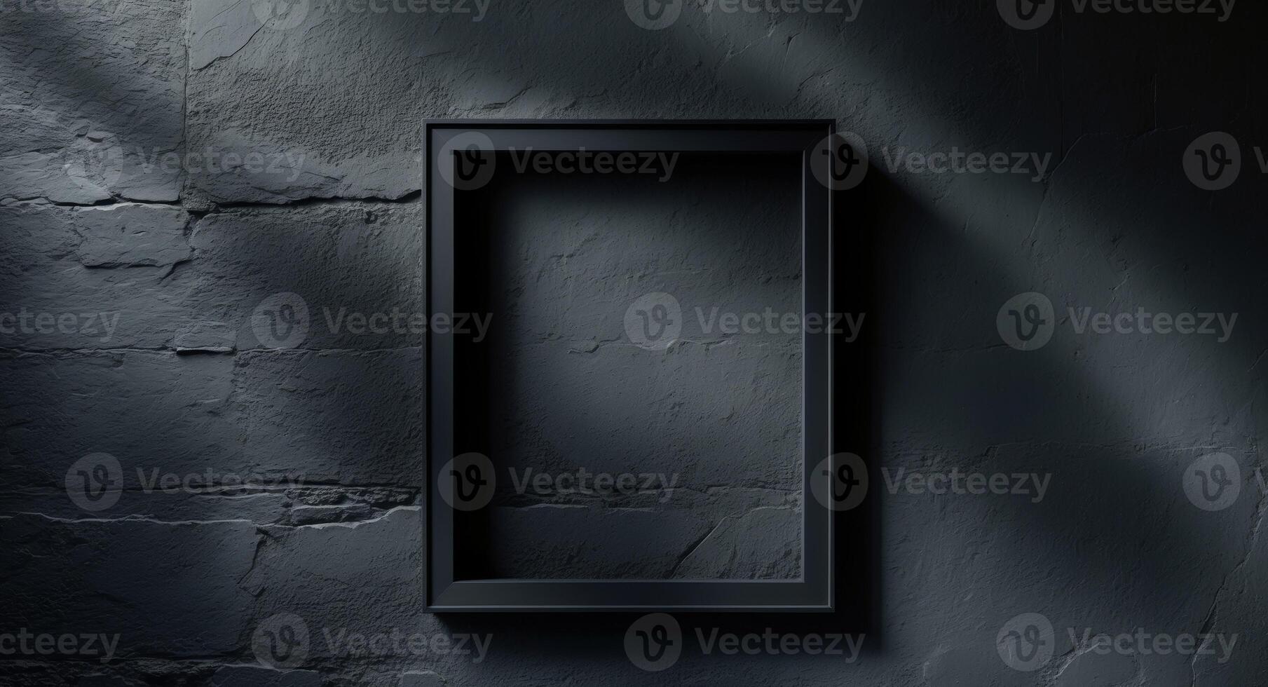 Empty black frame on a wall with shadows photo