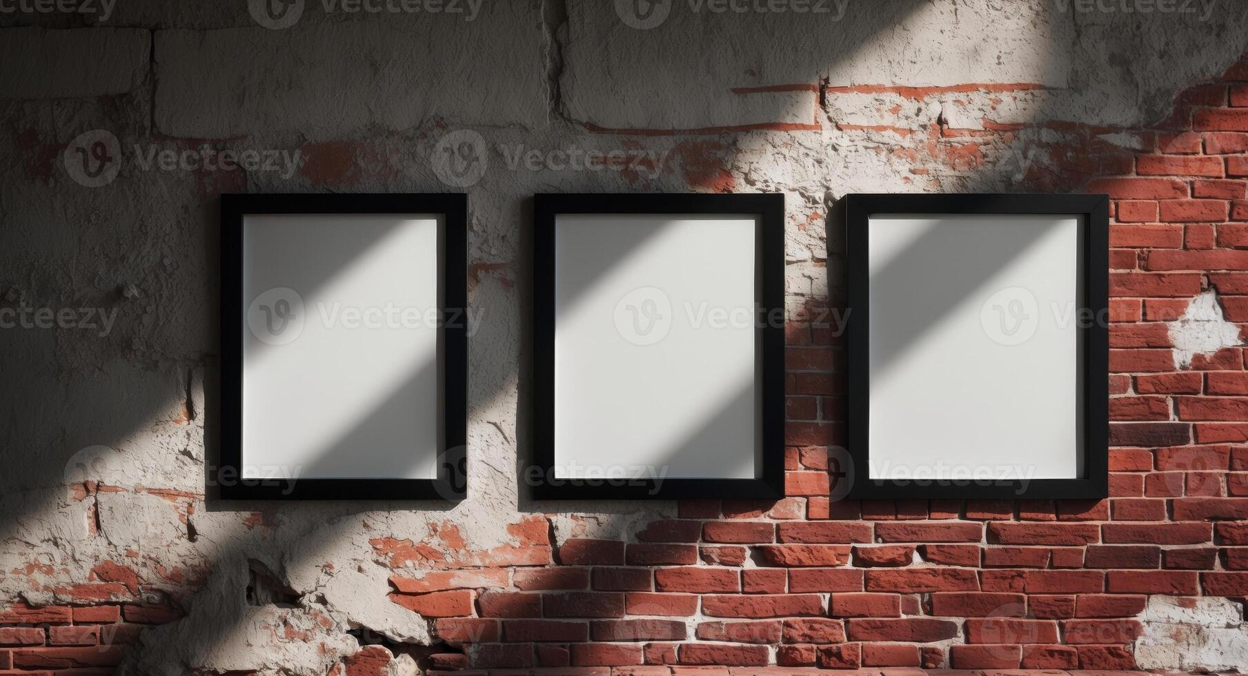 Three empty frames on a brick wall photo