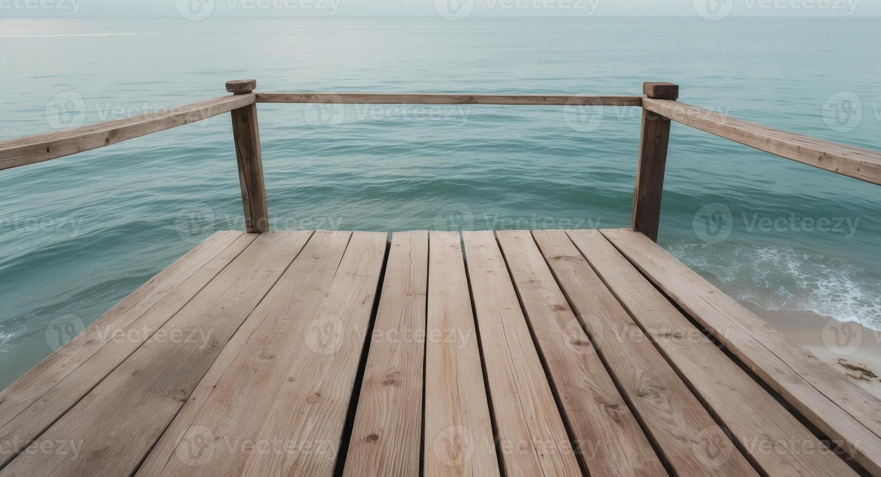 Wooden Pier Extending Over Calm Ocean Waters, A Serene Coastal Perspective photo