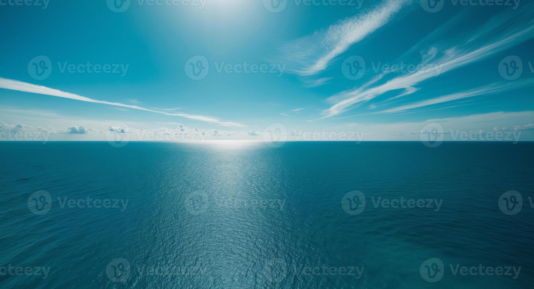 Azure Serenity. A Breathtaking View of the Open Ocean and Azure Sky with Cirrus Clouds. photo