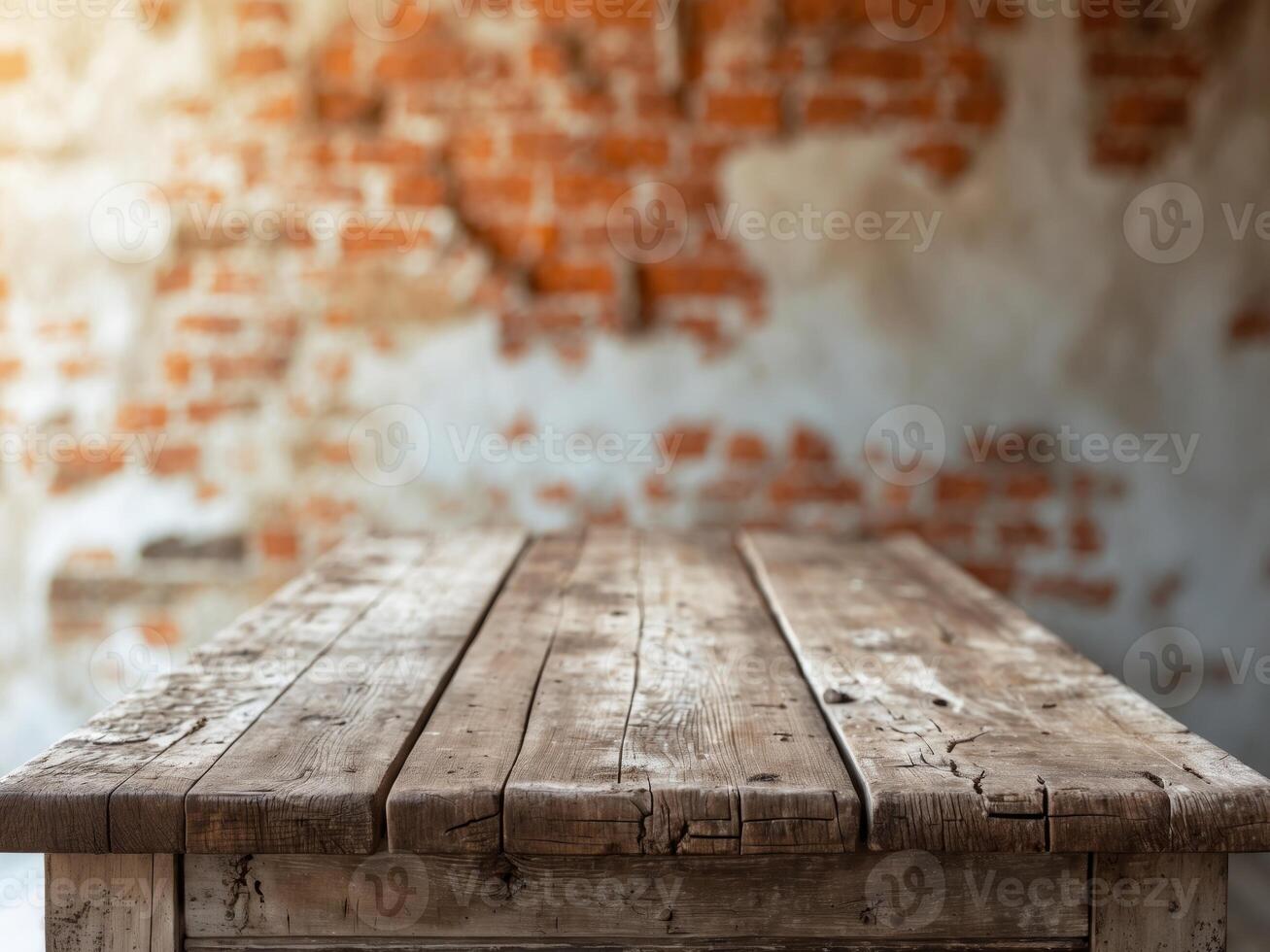 Rustic Wooden Table Against a Distressed Brick Wall, Perfect for Product Mockups. photo