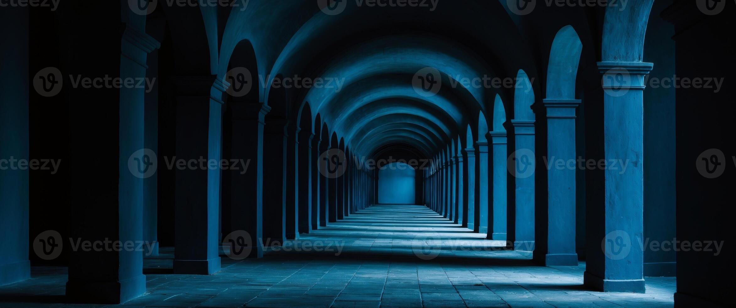 Eerie Blue Arched Corridor with Dim Light, Creating a Sense of Depth and Mystery. photo
