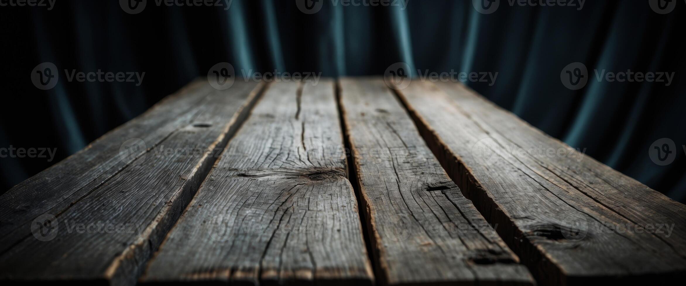 Rustic Wooden Tabletop Against a Dark Blue Curtained Background, Great for Mockups. photo